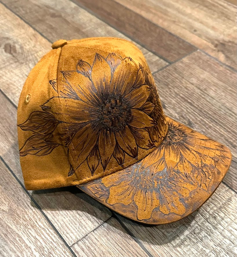 Brown cap with floral embossing on a wooden surface